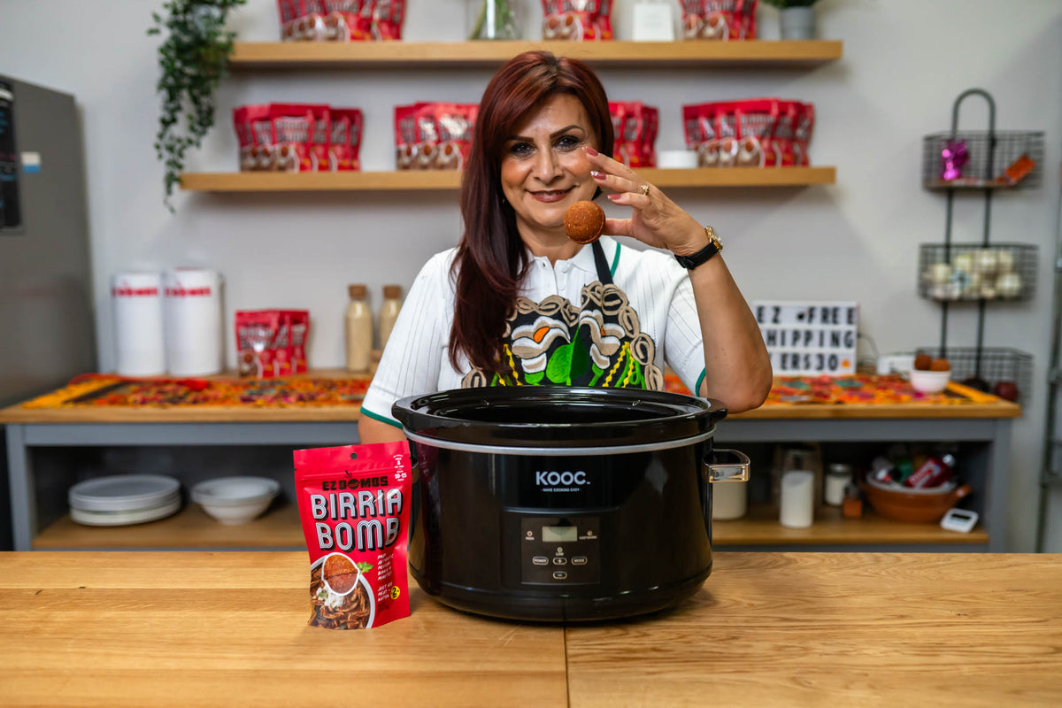 Tina from EZ Bombs holding a bomb in her kitchen