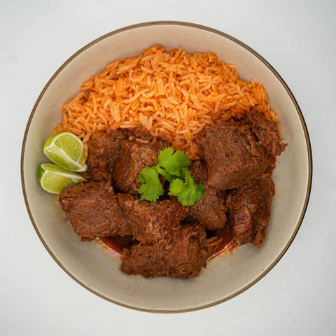 A plate of chile colorado over rice