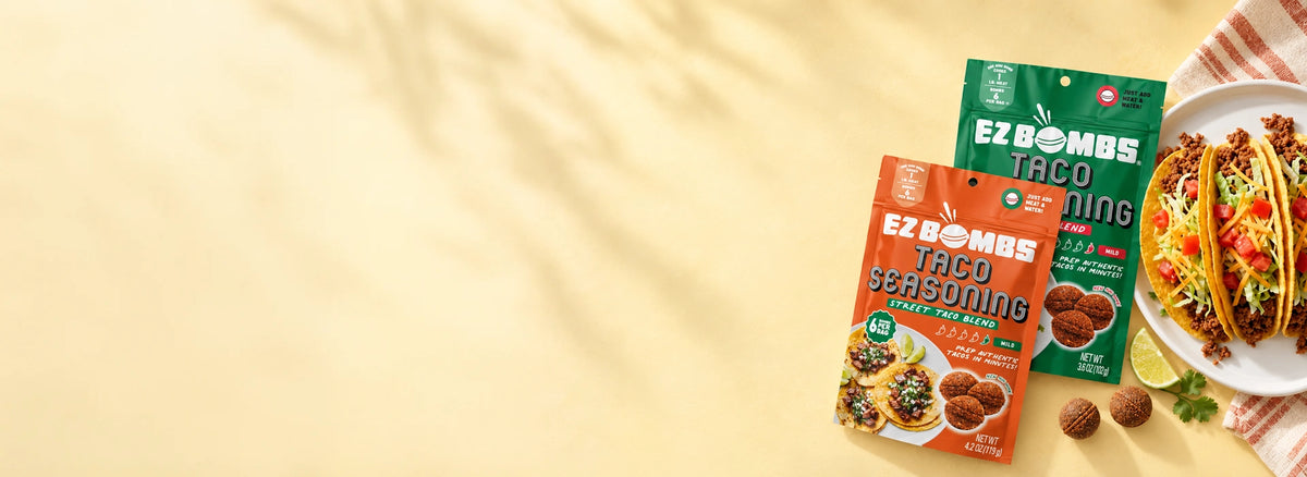 EZ Bombs Taco Seasoning Street Taco Blend and Original Blend pouches beside a plate of tacos